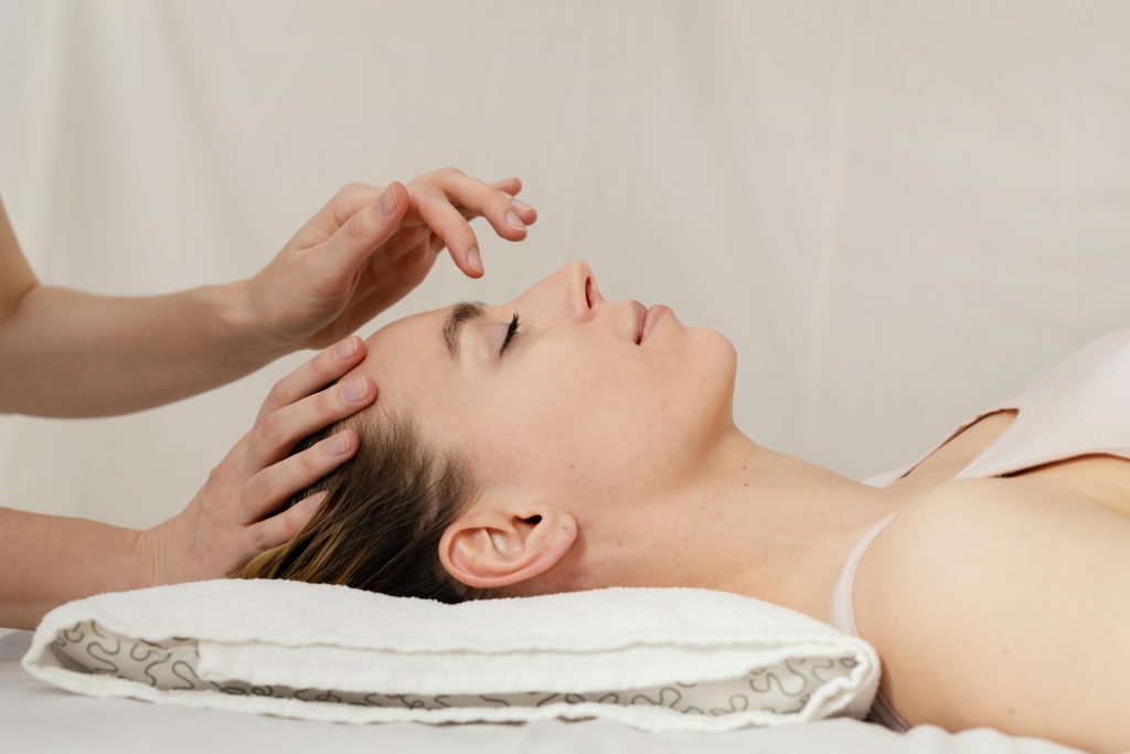 close up therapist massaging patient s head